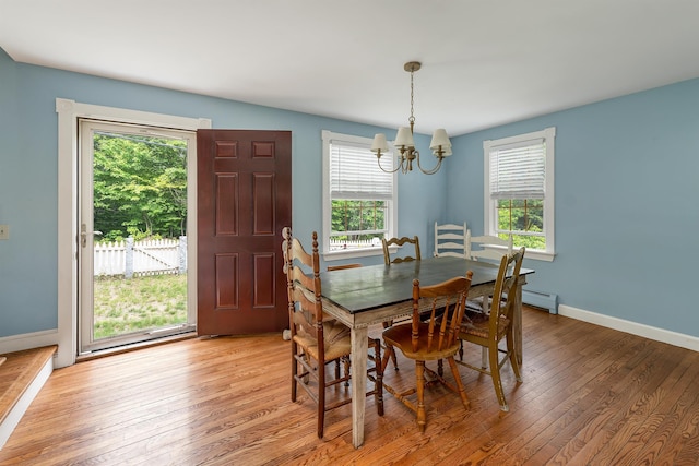 400 Turkey St, Tamworth, NH 03886 - dining area with a chandelier, light wood-type flooring, and a baseboard radiator