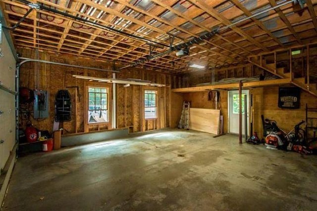 400 Turkey St, Tamworth, NH 03886 - garage featuring electric panel and a garage door opener