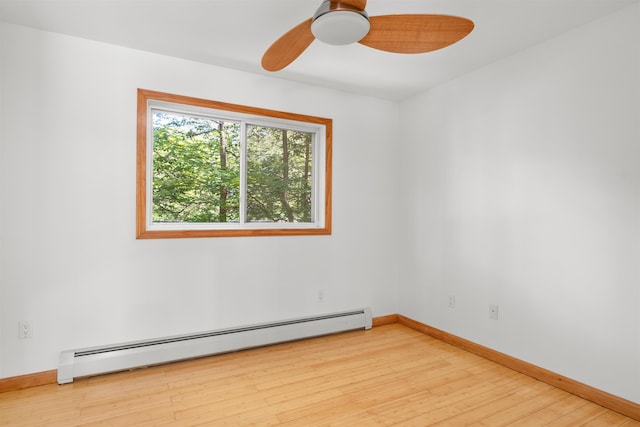 12 Cornwall Pl, Farmington, NH 03835 - spare room featuring a baseboard radiator, light wood-type flooring, and ceiling fan