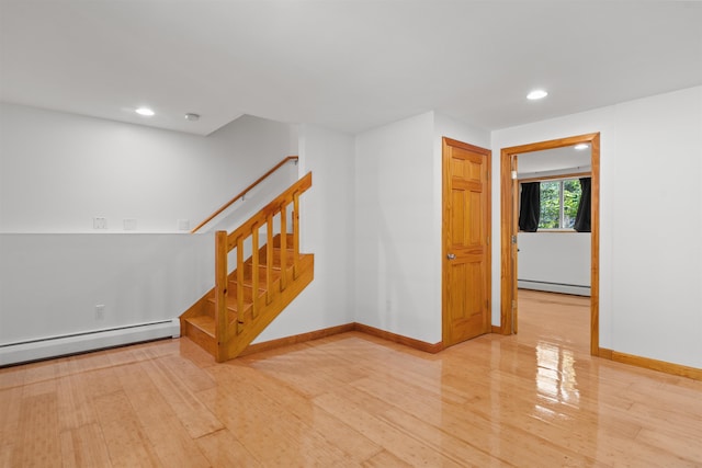 12 Cornwall Pl, Farmington, NH 03835 - unfurnished room featuring a baseboard heating unit, wood finished floors, recessed lighting, and stairway
