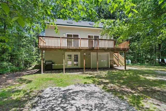 12 Cornwall Pl, Farmington, NH 03835 - back of house featuring an attached garage, french doors, a deck, and stairway