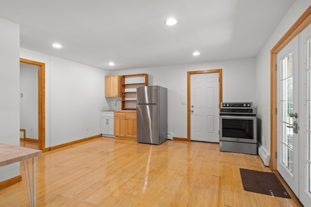 12 Cornwall Pl, Farmington, NH 03835 - kitchen with stainless steel appliances, recessed lighting, light wood-type flooring, a baseboard heating unit, and open shelves