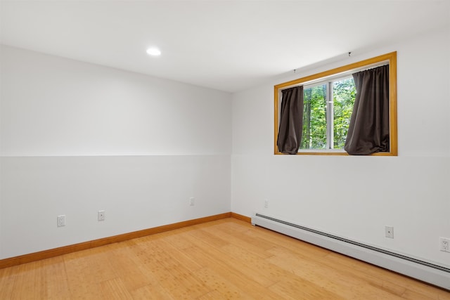 12 Cornwall Pl, Farmington, NH 03835 - spare room with a baseboard radiator, light wood-style floors, and recessed lighting