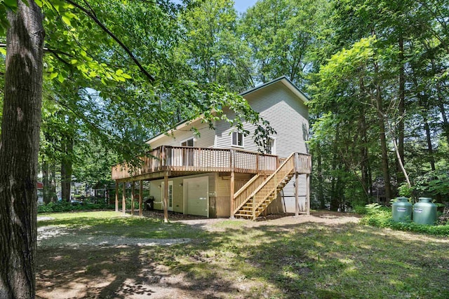 12 Cornwall Pl, Farmington, NH 03835 - back of property with stairs and a deck