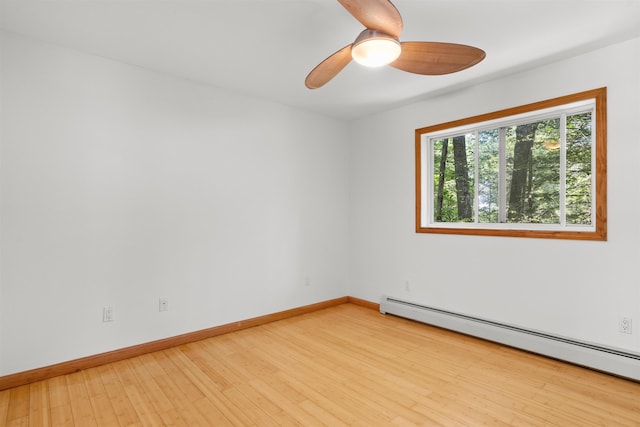 12 Cornwall Pl, Farmington, NH 03835 - unfurnished room with a baseboard heating unit, a ceiling fan, and light wood-style floors