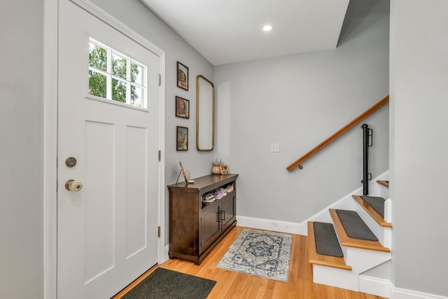 34 Leonard St, Rochester, NH 03867 - entrance foyer with stairs and light wood-style flooring