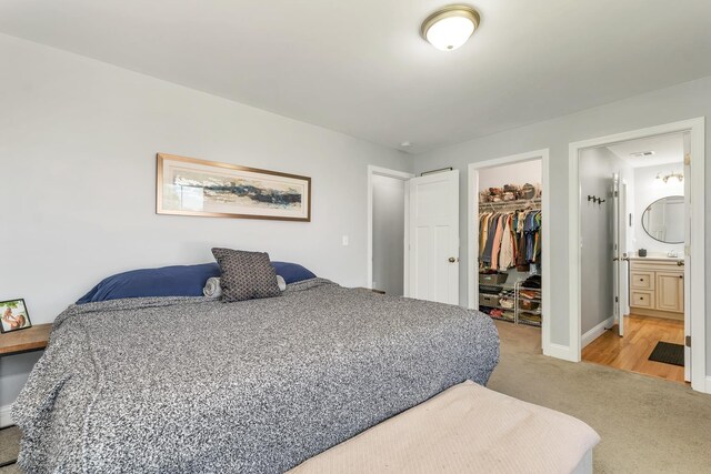 34 Leonard St, Rochester, NH 03867 - bedroom featuring light carpet, a closet, a walk in closet, and connected bathroom