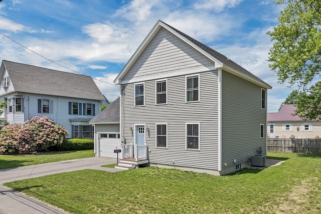 34 Leonard St, Rochester, NH 03867 - view of front of house with an attached garage, concrete driveway, and a shingled roof