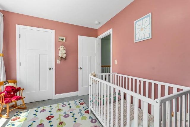 34 Leonard St, Rochester, NH 03867 - carpeted bedroom featuring a crib