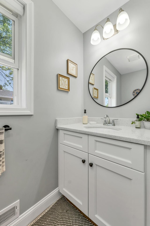 34 Leonard St, Rochester, NH 03867 - bathroom featuring vanity and baseboards