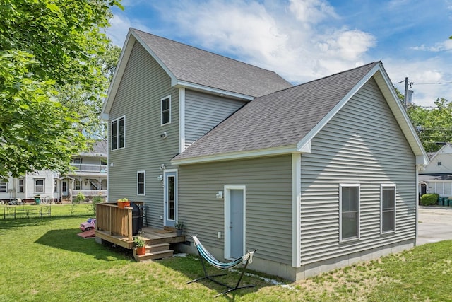 34 Leonard St, Rochester, NH 03867 - back of property with a shingled roof and a deck