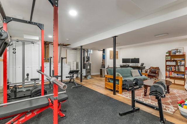 34 Leonard St, Rochester, NH 03867 - workout area with independent washer and dryer and wood finished floors