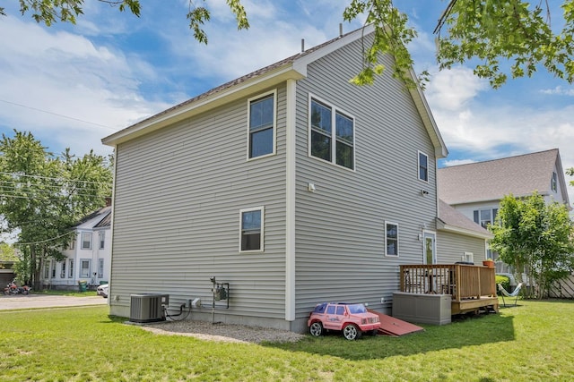 34 Leonard St, Rochester, NH 03867 - view of property exterior with a wooden deck and a lawn