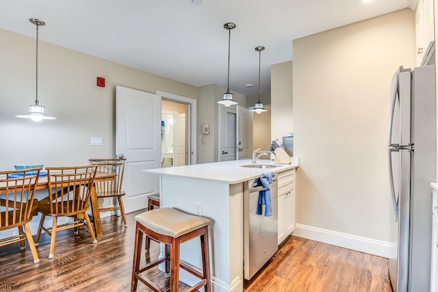 1 Ocean Ave Unit 210/212Fraction 3, York, ME 03909 - kitchen featuring appliances with stainless steel finishes, a peninsula, light wood finished floors, and light countertops