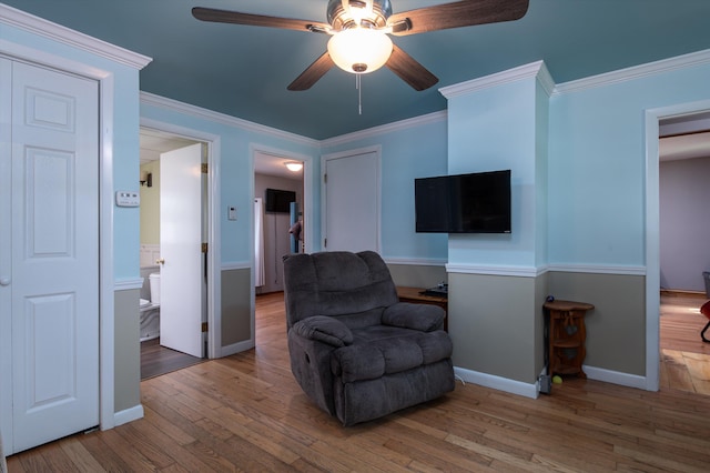 817 York Street Ext, Poultney, VT 05764 - sitting room with wood finished floors, ceiling fan, and crown molding