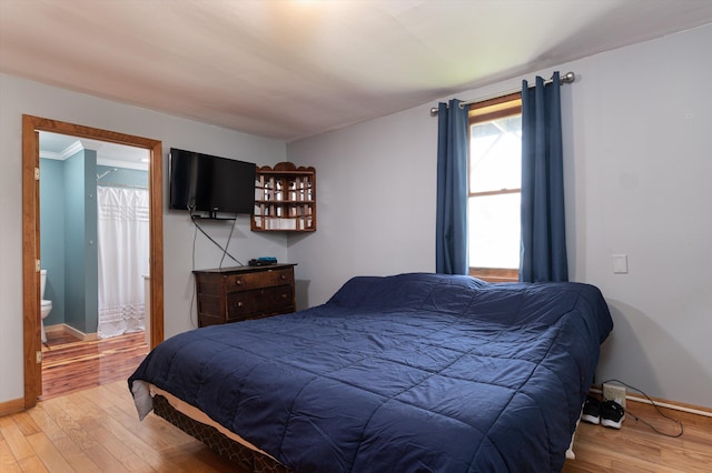 817 York Street Ext, Poultney, VT 05764 - bedroom with light wood finished floors and ensuite bathroom