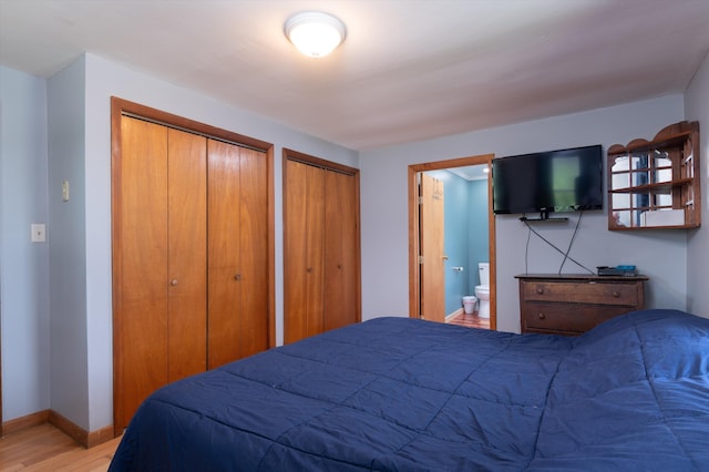 817 York Street Ext, Poultney, VT 05764 - bedroom with wood finished floors, multiple closets, and ensuite bathroom