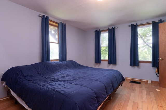817 York Street Ext, Poultney, VT 05764 - bedroom featuring hardwood / wood-style floors and multiple windows