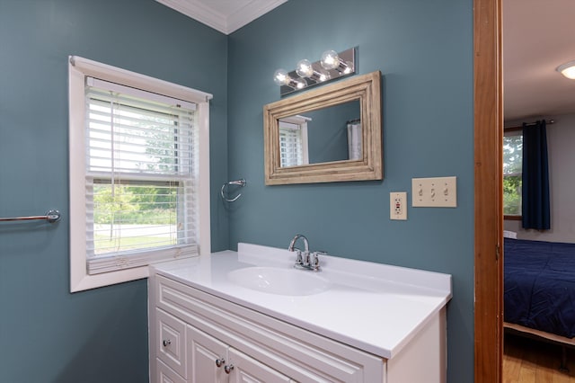 817 York Street Ext, Poultney, VT 05764 - bathroom featuring vanity, crown molding, and wood finished floors