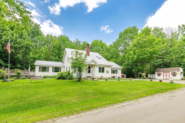 1307 Lime Kiln Rd, Haverhill, NH 03780 - view of front of house with a storage shed, a chimney, and a metal roof