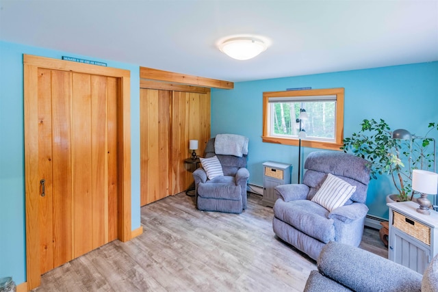 1307 Lime Kiln Rd, Haverhill, NH 03780 - sitting room with wood finished floors and a baseboard heating unit