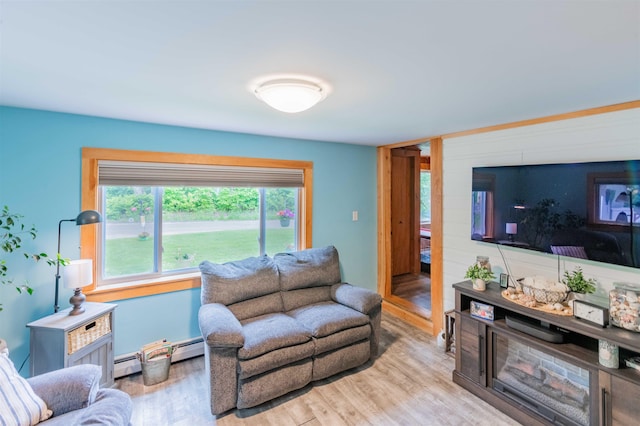 1307 Lime Kiln Rd, Haverhill, NH 03780 - living area with wood finished floors and a baseboard heating unit