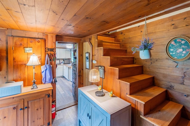 1307 Lime Kiln Rd, Haverhill, NH 03780 - stairway featuring wooden walls, wood finished floors, and wooden ceiling