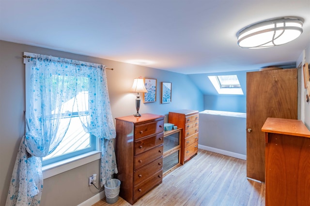 1307 Lime Kiln Rd, Haverhill, NH 03780 - bedroom with a skylight, light wood finished floors, and vaulted ceiling