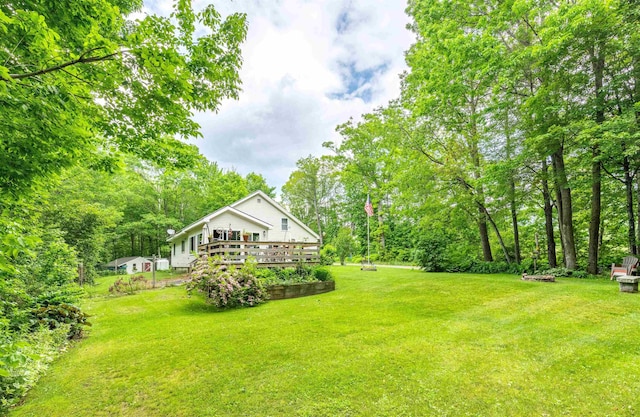 1307 Lime Kiln Rd, Haverhill, NH 03780 - view of grassy yard with a wooden deck