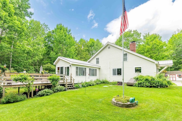 1307 Lime Kiln Rd, Haverhill, NH 03780 - rear view of property featuring a wooden deck, a chimney, and a yard