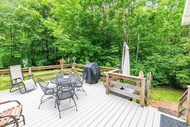 1307 Lime Kiln Rd, Haverhill, NH 03780 - wooden deck with area for grilling, outdoor dining space, and a forest view