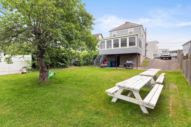 15 Ocean Blvd, Hampton, NH 03842 - back of property with stairway and a sunroom