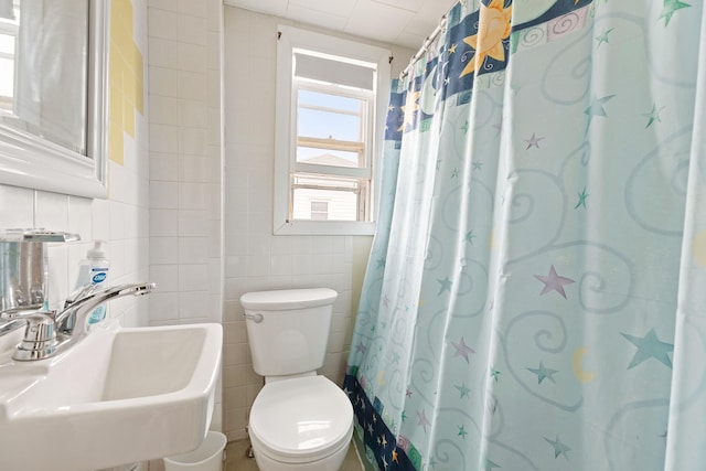 15 Ocean Blvd, Hampton, NH 03842 - bathroom featuring a sink and tile walls