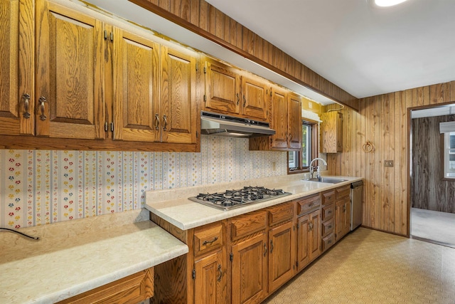 6 Davis Dr, Lebanon, NH 03766 - kitchen featuring under cabinet range hood, stainless steel appliances, light countertops, brown cabinetry, and light floors