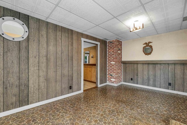 6 Davis Dr, Lebanon, NH 03766 - empty room featuring wood walls and stone finish floors