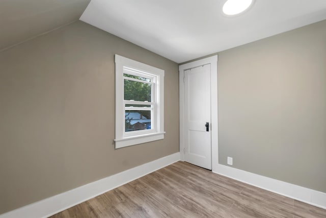6 Davis Dr, Lebanon, NH 03766 - unfurnished bedroom featuring light wood-style floors, a closet, and lofted ceiling