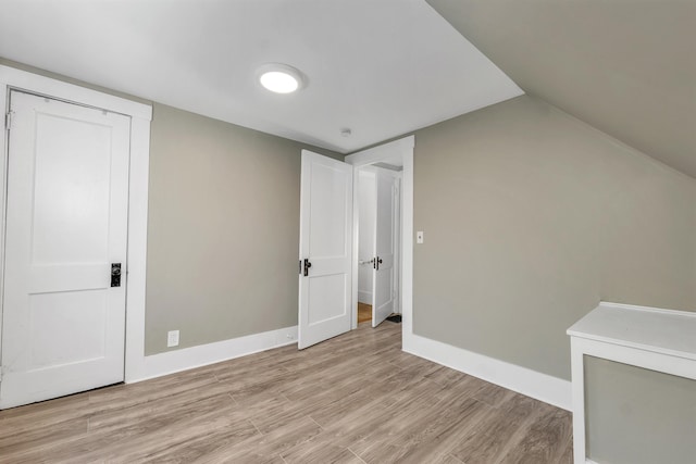 6 Davis Dr, Lebanon, NH 03766 - additional living space with light wood-type flooring and lofted ceiling