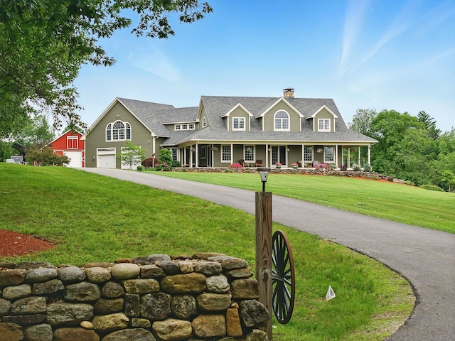 84 Shaw Rd, Northfield, NH 03276 - view of front of house featuring a chimney, an attached garage, a front yard, and a porch