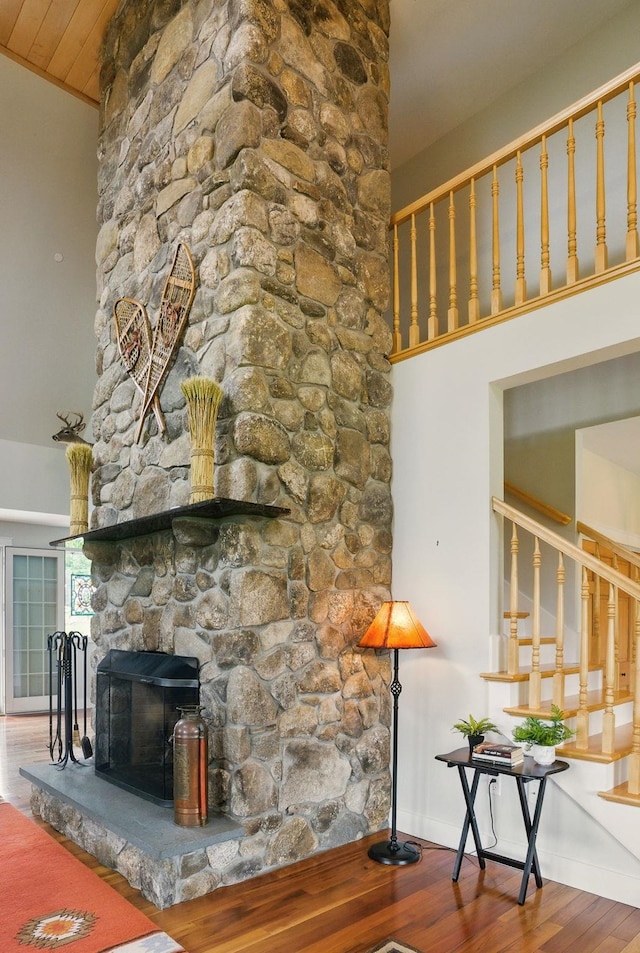 84 Shaw Rd, Northfield, NH 03276 - unfurnished living room featuring wood finished floors and a stone fireplace