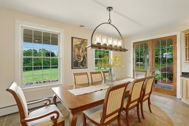 84 Shaw Rd, Northfield, NH 03276 - dining room with light tile patterned floors, plenty of natural light, and a baseboard heating unit