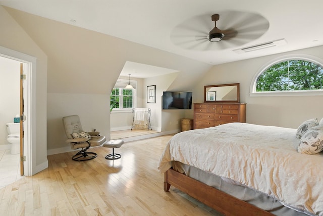 84 Shaw Rd, Northfield, NH 03276 - bedroom with wood finished floors, lofted ceiling, and ensuite bath