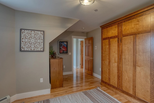 84 Shaw Rd, Northfield, NH 03276 - corridor with baseboard heating and light wood-type flooring
