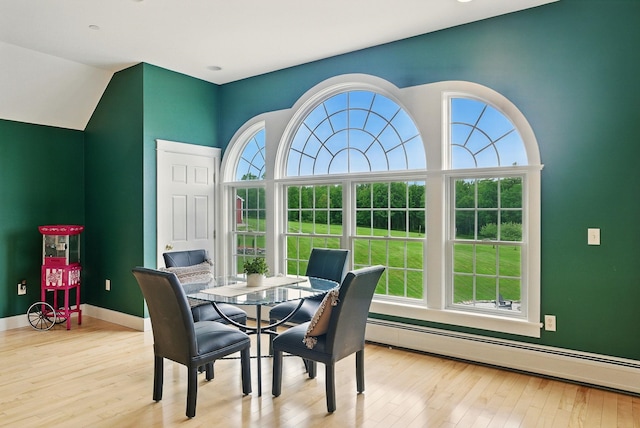 84 Shaw Rd, Northfield, NH 03276 - dining space with wood finished floors, baseboard heating, and vaulted ceiling