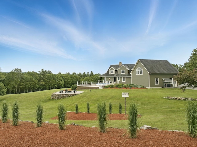 84 Shaw Rd, Northfield, NH 03276 - rear view of house with a lawn and a chimney