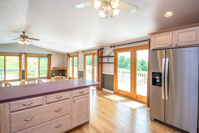 98 Rowell Rd, Lancaster, NH 03584 - kitchen featuring stainless steel refrigerator with ice dispenser, ceiling fan, vaulted ceiling, wainscoting, and light wood-type flooring