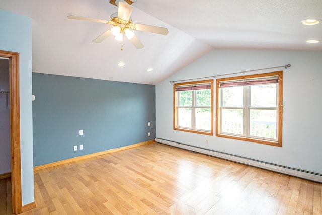 98 Rowell Rd, Lancaster, NH 03584 - unfurnished bedroom featuring baseboard heating, lofted ceiling, wood finished floors, ceiling fan, and recessed lighting