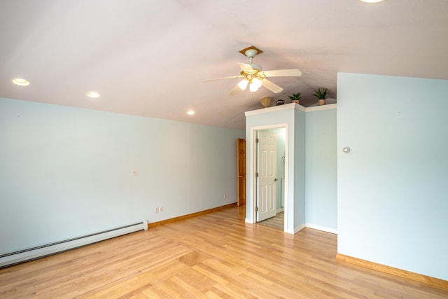 98 Rowell Rd, Lancaster, NH 03584 - spare room with baseboard heating, a ceiling fan, light wood finished floors, vaulted ceiling, and recessed lighting
