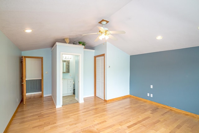 98 Rowell Rd, Lancaster, NH 03584 - unfurnished bedroom with lofted ceiling, light wood-style flooring, connected bathroom, recessed lighting, and a ceiling fan