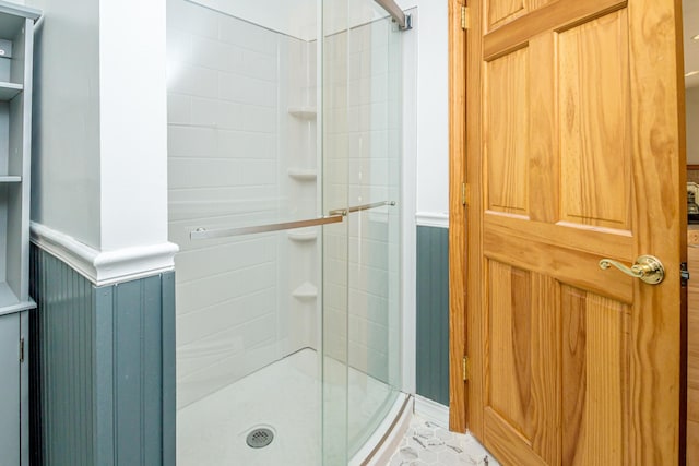 98 Rowell Rd, Lancaster, NH 03584 - bathroom with a shower stall and a wainscoted wall