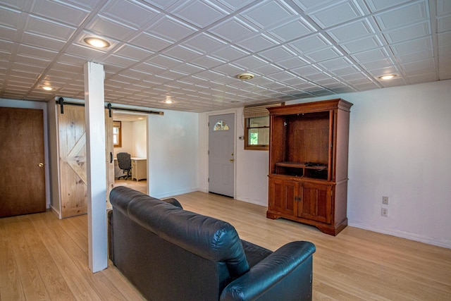 98 Rowell Rd, Lancaster, NH 03584 - living room with a barn door, light wood-style flooring, and recessed lighting